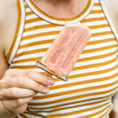 woman holding popsicle