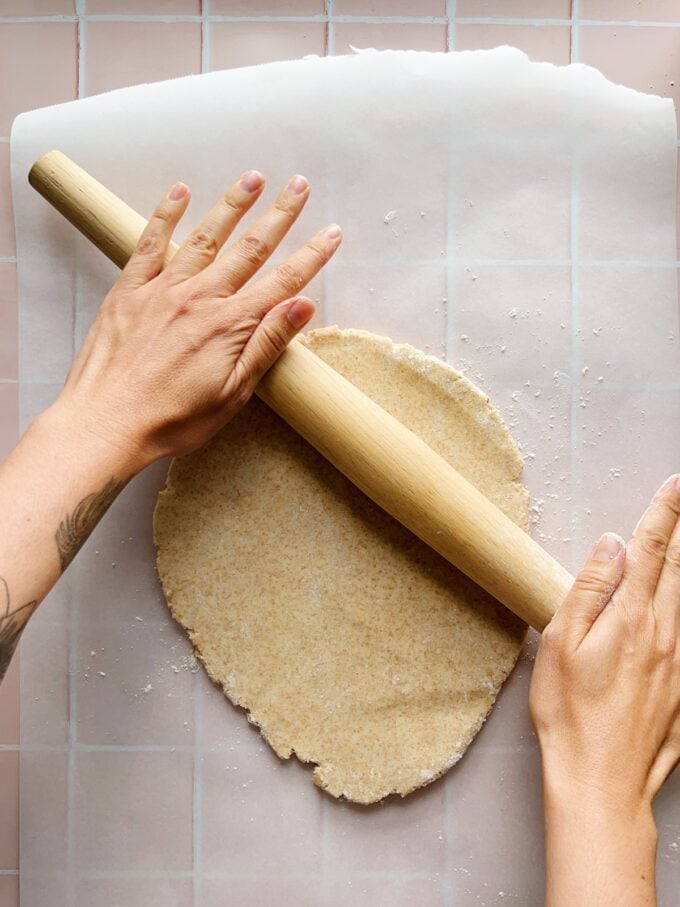 hands rolling dough